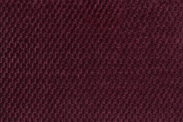 Dark purple background from soft fleecy fabric closeup. Texture of textile macro