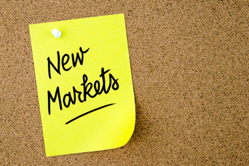 New Markets text written on yellow paper note