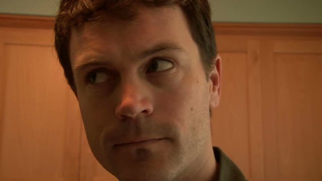 Close up of curious and creepy man's reactions.