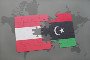 puzzle with the national flag of austria and libya on a world map background.