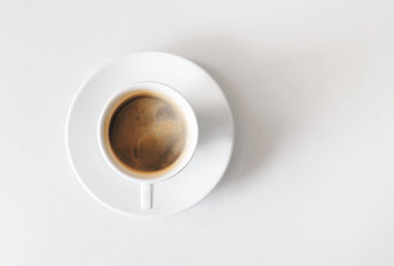 Cup of coffee on white table