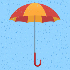 красно-желтый зонт на фоне дождя
