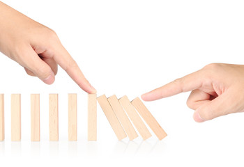 hand stop  dominoes continuous toppled