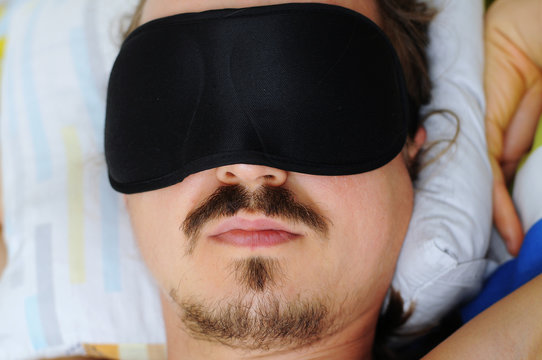 man with sleep mask