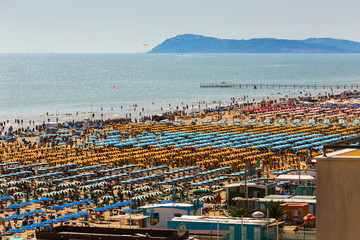 Large group of parasols at the beach of Rimini