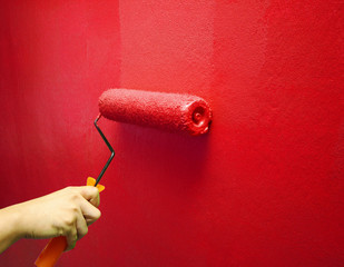 Painting Red Color on the wall background