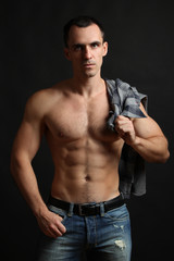 Fototapeta na wymiar Muscular male torso. Perfect fit, shoulders, deltoids, biceps, triceps and chest.