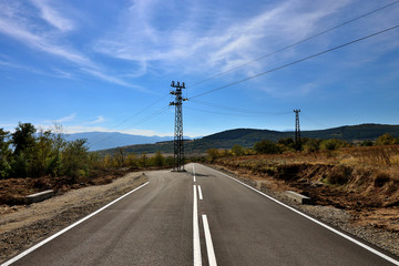 Fototapeta na wymiar power pole in the middle of the road in Bulgaria