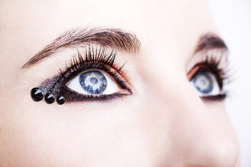 Fototapeta premium Eye Makeup. Beautiful Eyes Glitter Make-up. Holiday Makeup detail
