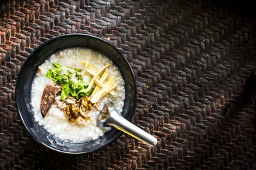 rice gruel in bowl on tablecloth in morning