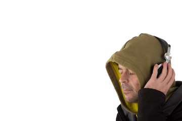Man in hoodie listening to headphones