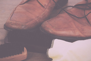 Shoes and cleaning equipment on a wooden floor Vintage Retro Fil