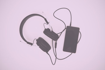 Black headphones against a light coloured background Vintage Ret