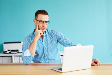 Pensice man working in modern office