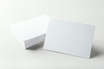 blank business cards on grey background