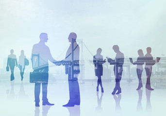 business people silhouettes and modern cityscape