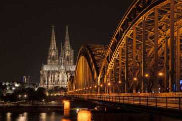 Illuminated bridge in Cologne at night