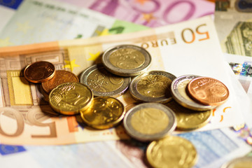 Euro coins and banknotes money. Macro background.

