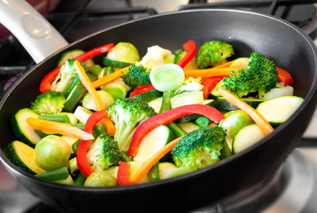 Vegetables cooking on frying pan