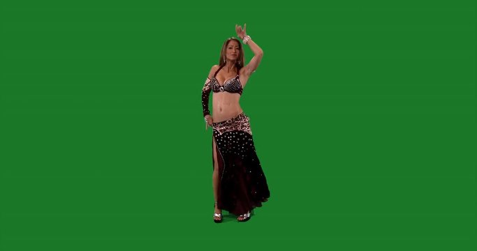 Belly dancer dancing ethnic dances.  Green screen. In  burgundi dress dancing . Full shot 2. 4K