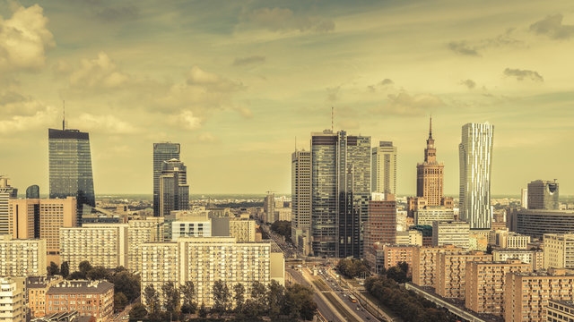 Fototapeta Warsaw Downtown with clouds, Poland. Vintage colors