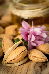Almond oil and almonds, selective focus