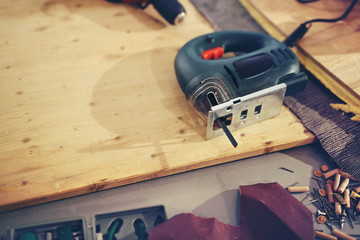 Jigsaw on the table in a carpentry workshop or garage.