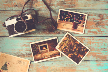 Fototapeta na wymiar Merry christmas (xmas) photo album on old wood table. paper photo of film camera - vintage and retro style