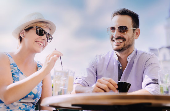 Happy couple enjoying in cafe