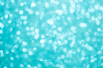 Christmas background. Blue bokeh festive abstract background with bokeh defocused lights and stars