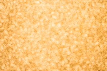 Christmas background. Yellow bokeh festive abstract background with bokeh defocused lights and stars