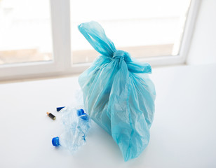 close up of rubbish bag with trash at home
