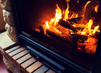 close up of burning fireplace at home