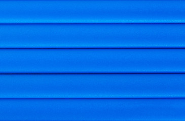 Texture of plastic panels, blue siding, house wall, plastic texture