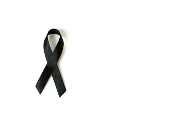 Black awareness ribbon on white background. Mourning and melanom
