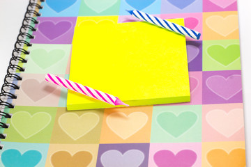 Happy birthday candle and blank notepad with love diary