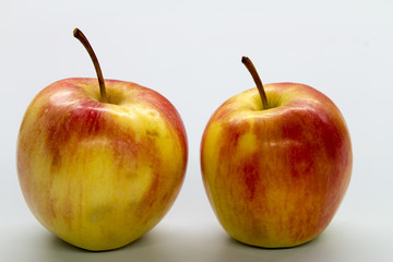 red apple on white table