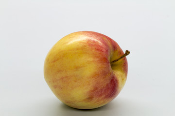 red apple on white table