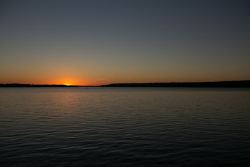 Fototapeta na wymiar Sunset on a calm lake in Ontario Canada