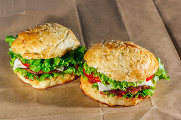 Fresh hamburgers on craft paper