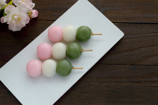 Hanami Dango is a Japanese dessert, where 3 different Dango balls, pink, white, and green, are skewered on a stick. It is often served during cherry blossoms viewing.
