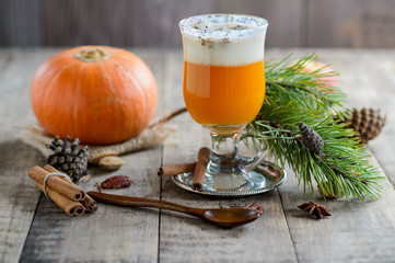 Vegan Creamy Delicious Pumkin juice on wooden rustic background