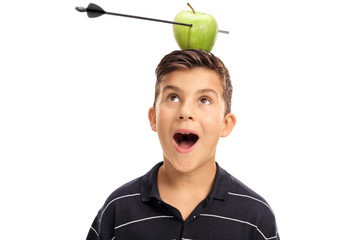 Boy looking at an apple pierced by an arrow