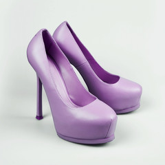 female purple shoes over white