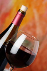 bottle and glass of red wine