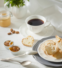 Cup of tea with biscuits and apricot jam