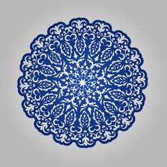 Die cut paper card with cutout mandala ornament.