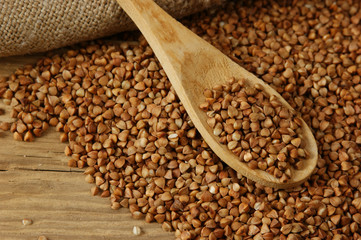 buckwheat groats and wooden spoon