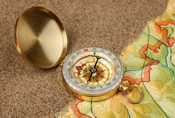 compass on the map with sand