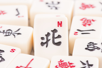 Mahjong board game pieces in close up. Concept of asian or chinese leisure activity, recreation and...